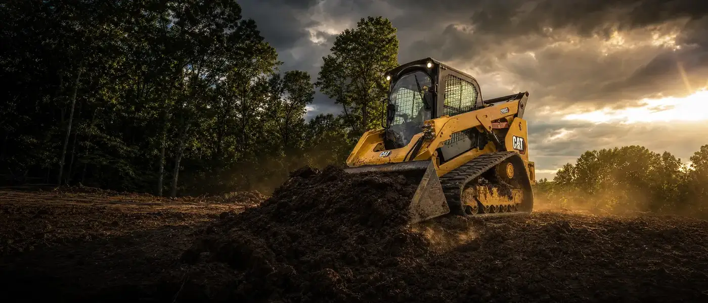 Wicks Land and Yard Management track loader clearing overgrown land in Godfrey, IL